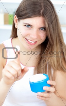 Beautiful girl using cream