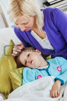 Sick cute child lying on couch