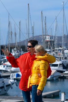 young man and woman in the port