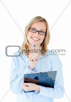 Pensive businesswoman holding a clipboard 