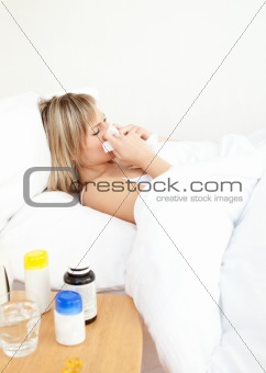Sick woman lying in bed