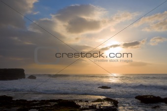 Rocky ocean coast at sunset