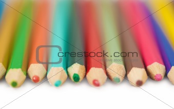 Set of color pencils on white background - close up