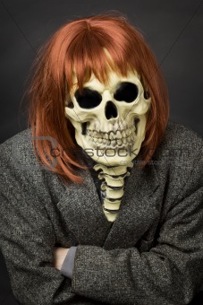 Person in mask of death and red wig