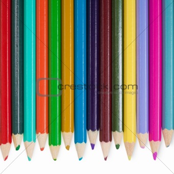 Fourteen color pencils on white background