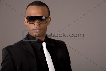 Ethnic young business man wearing sunglasses