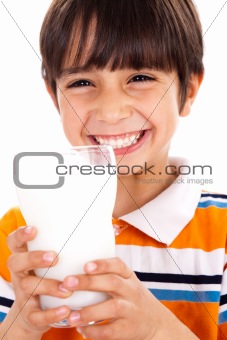 Young kid with glass of milk 