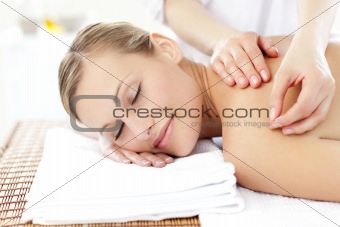 Radiant woman receiving an acupuncture treatment