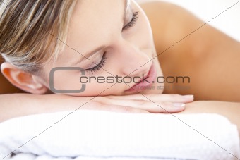 Close-up of a relaxed woman lying on a massage table 