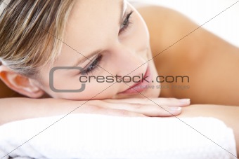 Close-up of a beautiful woman lying on a massage table 