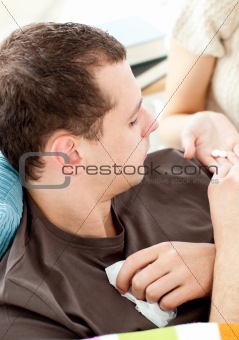 Close-up of a sick man taking pills from his girlfriend 
