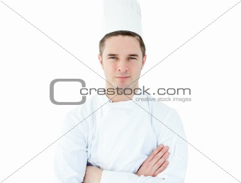 Attractive young chef  with folded arms 