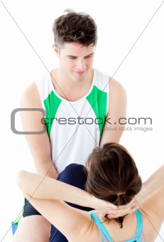 Attractive man doing fitness exercises with a woman 