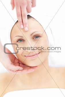 Cute woman receiveing a head massage