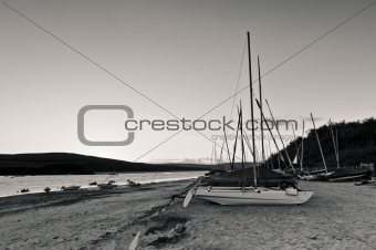 Black and White boats in the sand