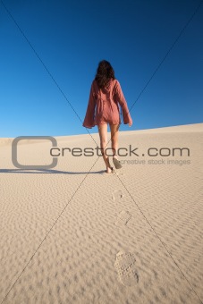 pretty woman on desert dune