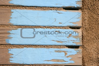 aged beach blue wooden floor on sand