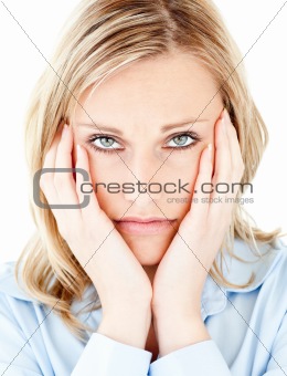 Portrait of an unhappy blond woman looking at the camera 