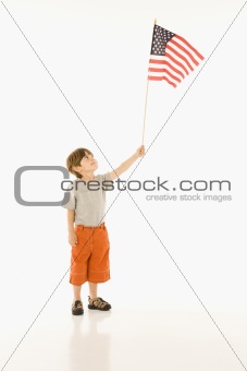 Boy holding American flag.