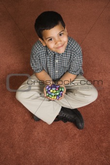 Boy holding Easter candy.