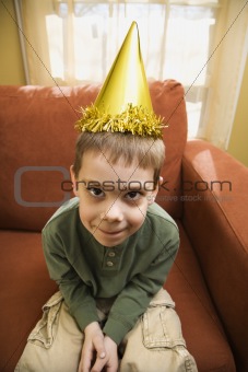 Boy in party hat.