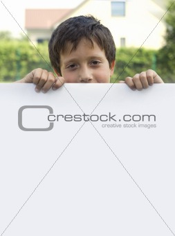 Boy keeps sheet of paper