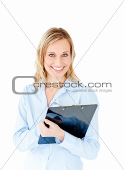 Assertive businesswoman taking notes on a clipboard