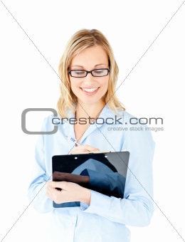 Confident businesswoman taking notes on a clipboard