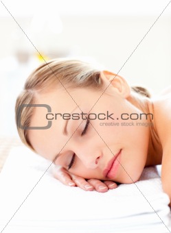 Close-up of a radiant woman lying on a massage table