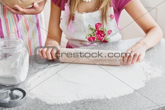 Close-up of two caucasian woman baking in the kitchen 