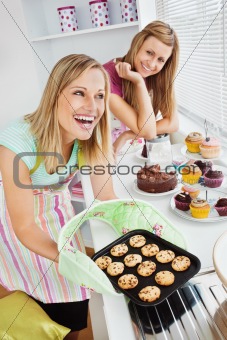 Laughing woman baking together
