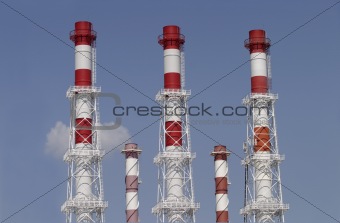 Five industrial color pipes isolated on blue