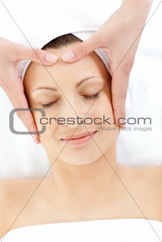Pretty caucasian woman having a head massage