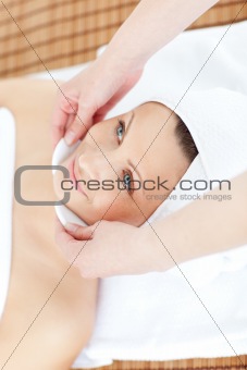 Positive woman receiving a beauty treatment 