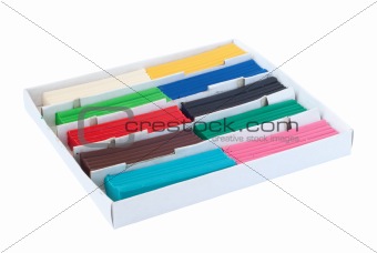 Box with pieces of colored plasticine