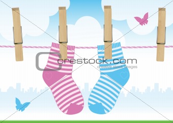 Vector illustration of a line with clothespins and baby socks.