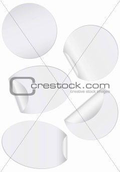 Vector illustration set of round unprinted stickers with peeled edge.