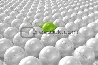White 3D balls with green one standing out