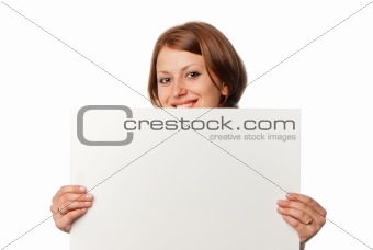 Smiling girl looks out from blank sheet