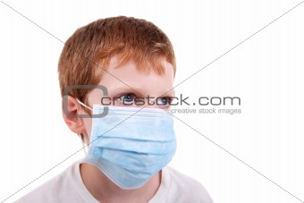 young boy with a medical mask, isolated on white, studio session
