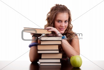happy beautiful girl , with a stack of books, and a apple, isolated on white. Studio shot