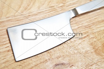 Steel cleaver on cutting table