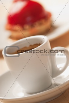 Cup of coffee and red cake