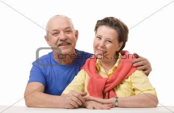 Happy senior couple against white background
