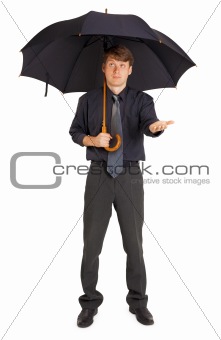 Person protected by a large umbrella