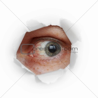 Human eye looks through hole
