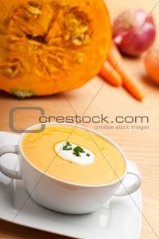 pumpkin soup in a white bowl