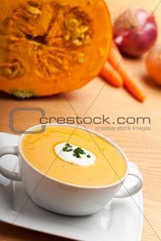 pumpkin soup in a white bowl