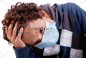 young boy with a medical mask, and the hand on head, isolated on white background, studio session