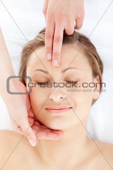 Relaxed young woman having a head massage 